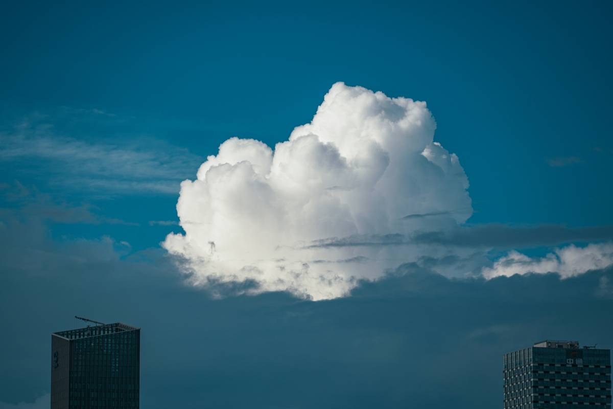 A cloud is in the sky over a city